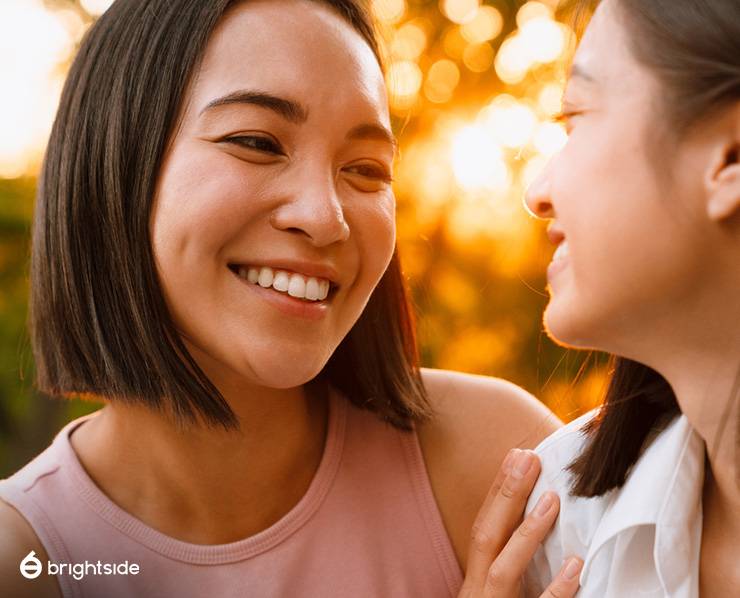 Image of person with white teeth interacting with another person