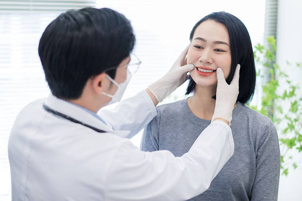 dentist checking patient's teeth
